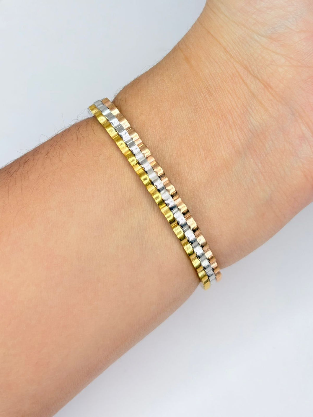 BRAZALETE TRENZADO 3 TONOS